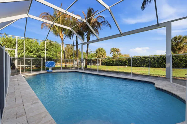 a view of outdoor space with swimming pool and furniture
