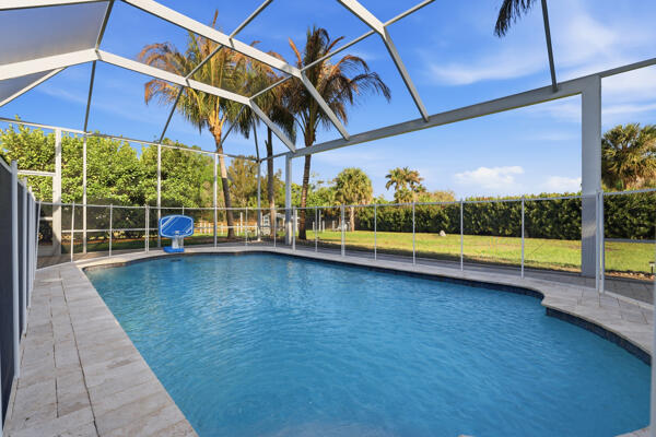 9301 154th Road North Jupiter, FL 33478 - Photo 28 of 39 a view of outdoor space with swimming pool and furniture