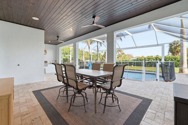 9301 154th Road North Jupiter, FL 33478 - Photo 29 of 39 a view of a dining room with furniture window and outside view
