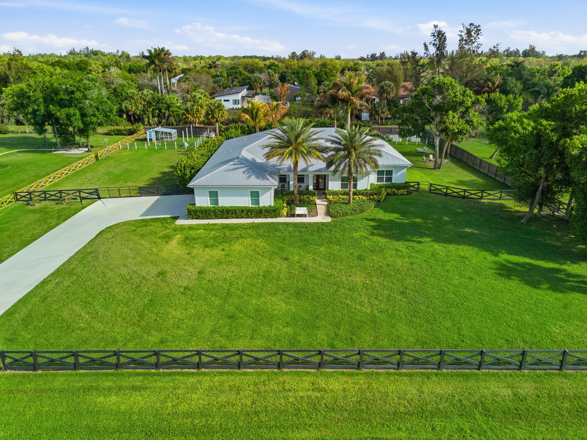 9301 154th Road North Jupiter, FL 33478 - Photo 37 of 39 a view of a golf course with a lake