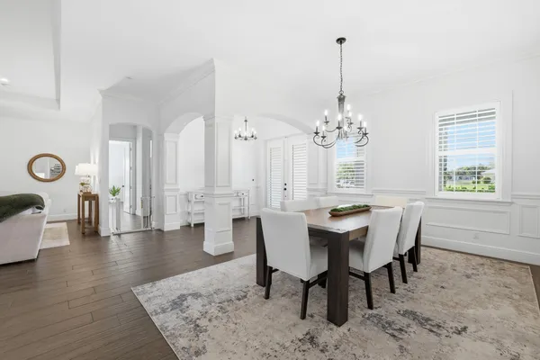 a view of a dining room with furniture window and wooden floor