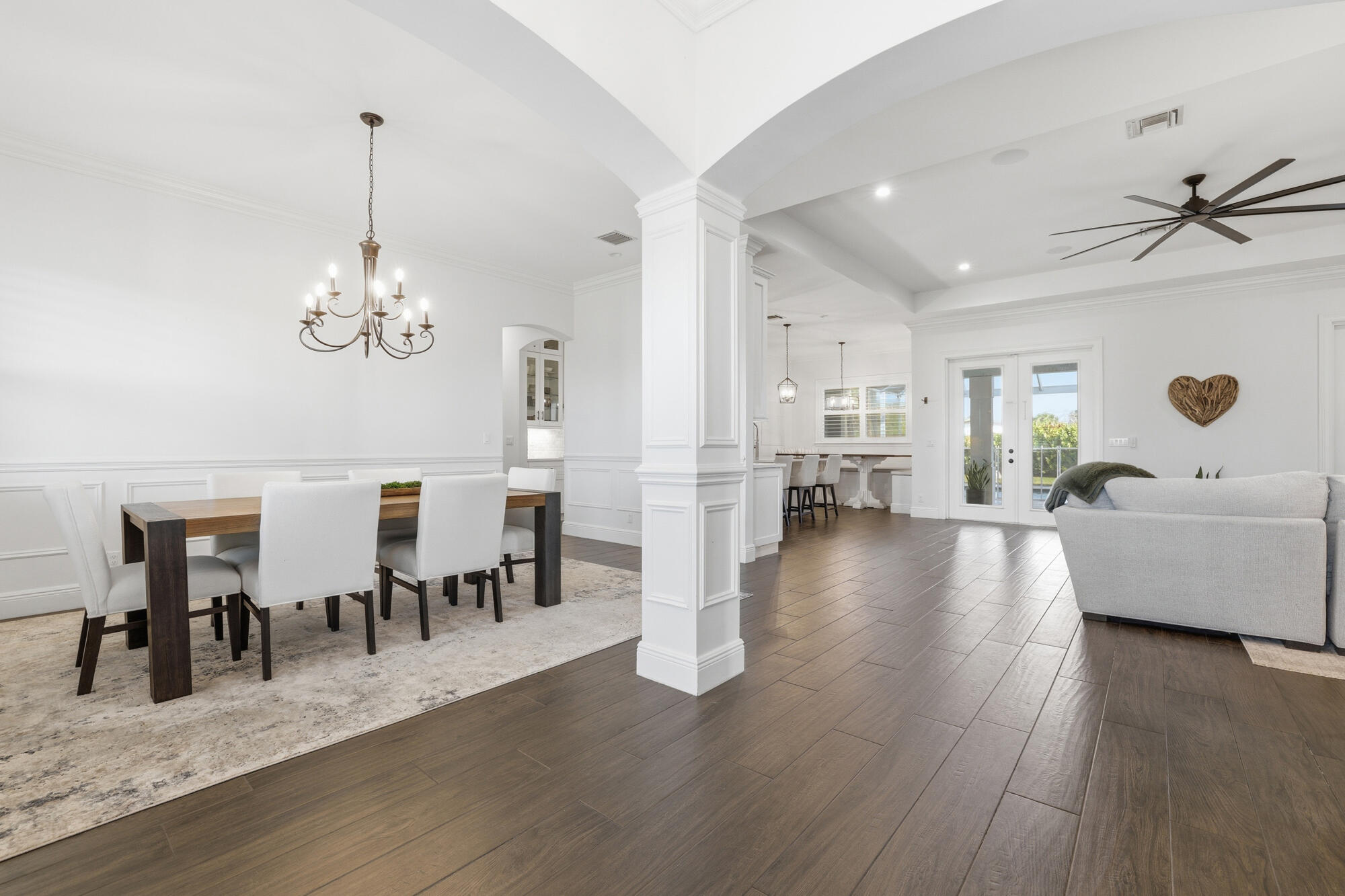 9301 154th Road North Jupiter, FL 33478 - Photo 10 of 39 a view of a dining room with furniture and wooden floor