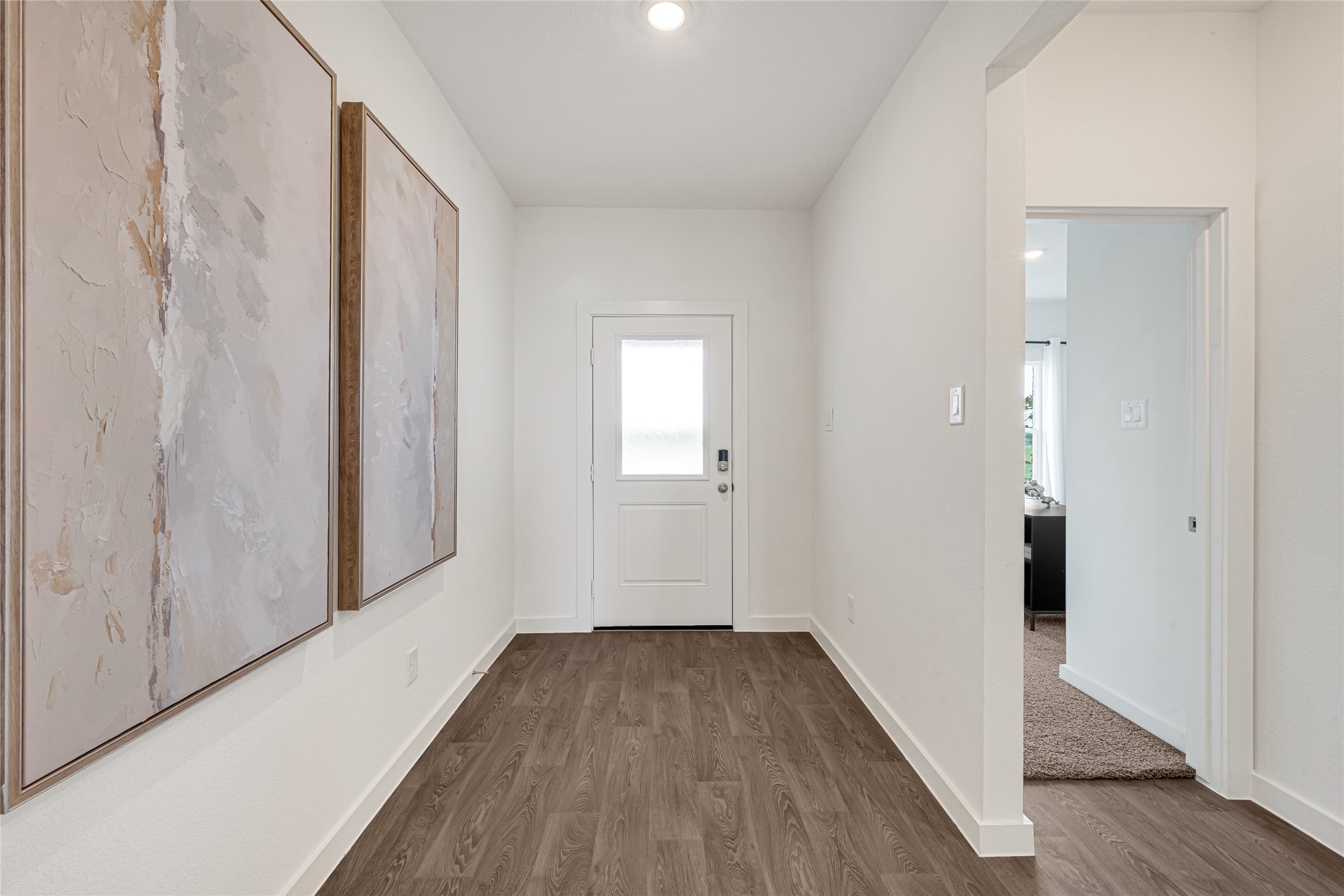 6204 Brookhaven Street Rosenberg, TX 77469 - Photo 5 of 33 a view of a hallway with wooden floor