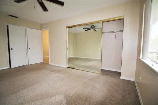 a view of an empty room with a window