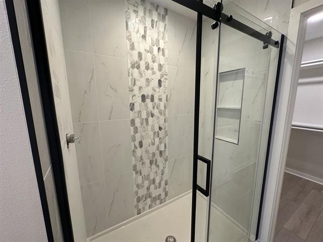 3156 South Bartells Drive Beloit, WI 53511 - Photo 19 of 33 a bathroom with a shower and a mirror