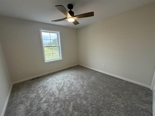 3156 South Bartells Drive Beloit, WI 53511 - Photo 22 of 33 an empty room with a window and ceiling fan