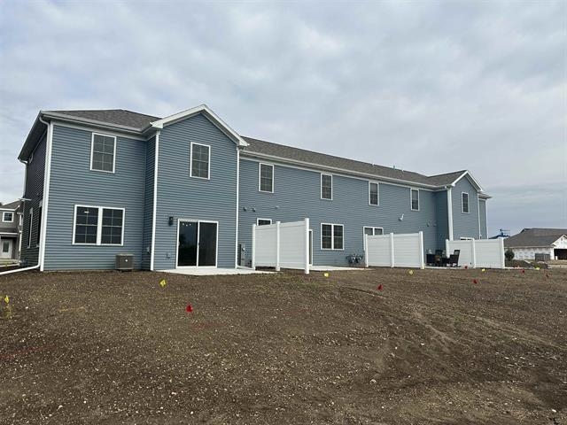 3156 South Bartells Drive Beloit, WI 53511 - Photo 27 of 33 a big house with large windows and a yard
