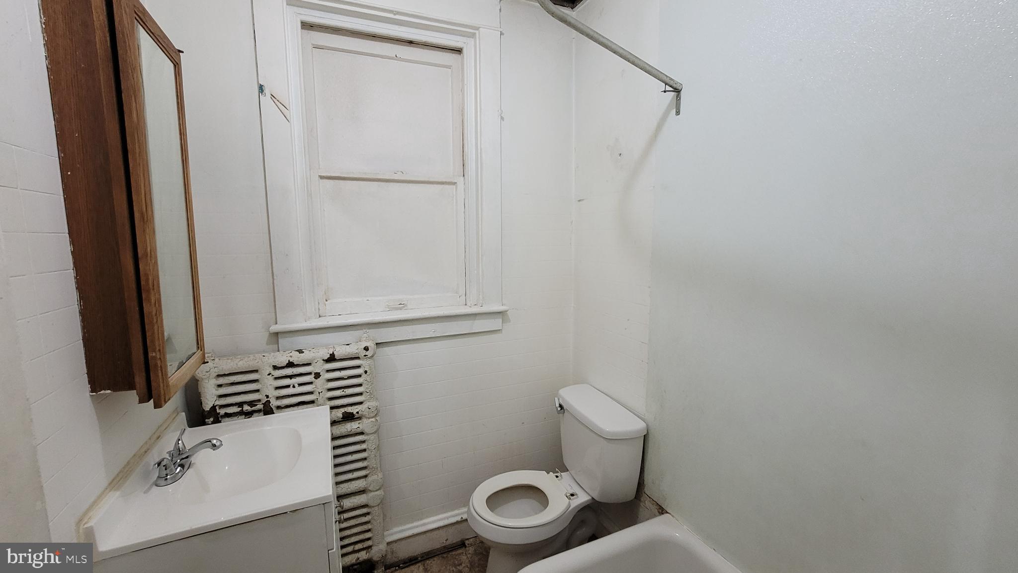 634 Centre Avenue, Unit 4 Reading, PA 19601 - Photo 17 of 20 a bathroom with a sink and toilet