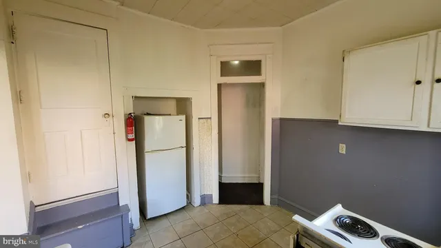 a room with a door open to a room
