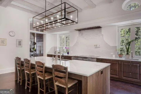 a kitchen with stainless steel appliances a refrigerator and a window