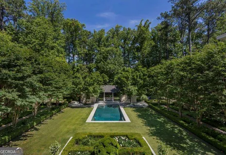 a bedroom with a large bed and a large window