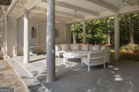 an aerial view of residential house with swimming pool and lawn chairs
