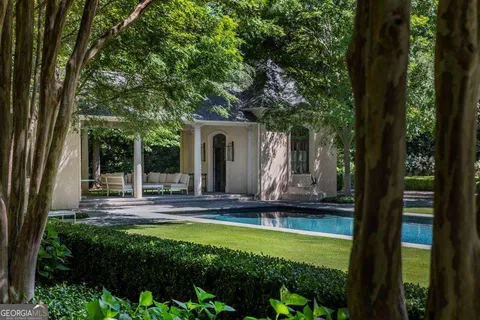 a view of swimming pool with a yard