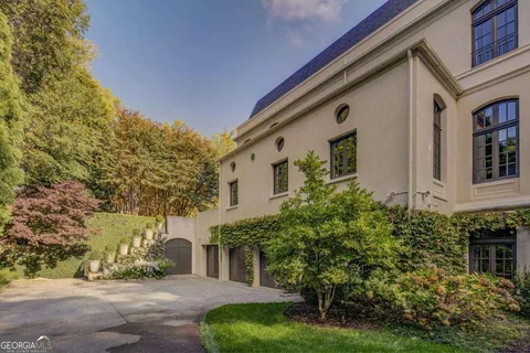 a front view of a house with garden