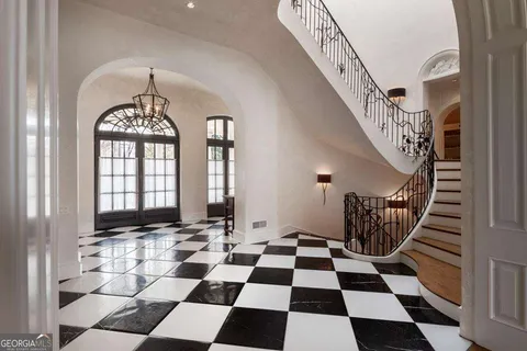a view of a dining room with furniture wooden floor and chandelier