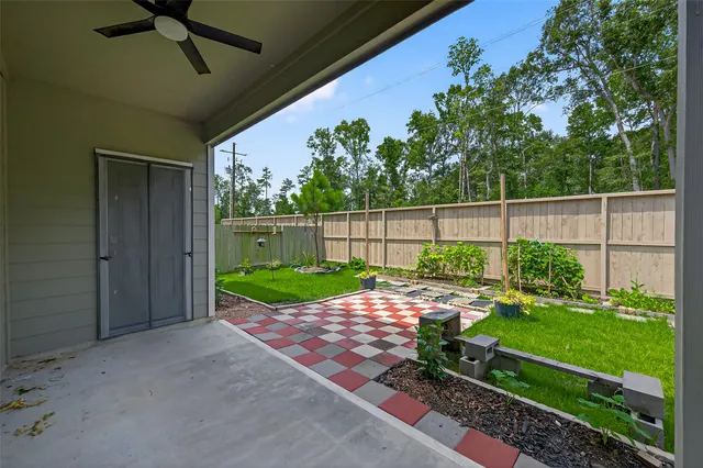 a view of backyard with seating area and green space
