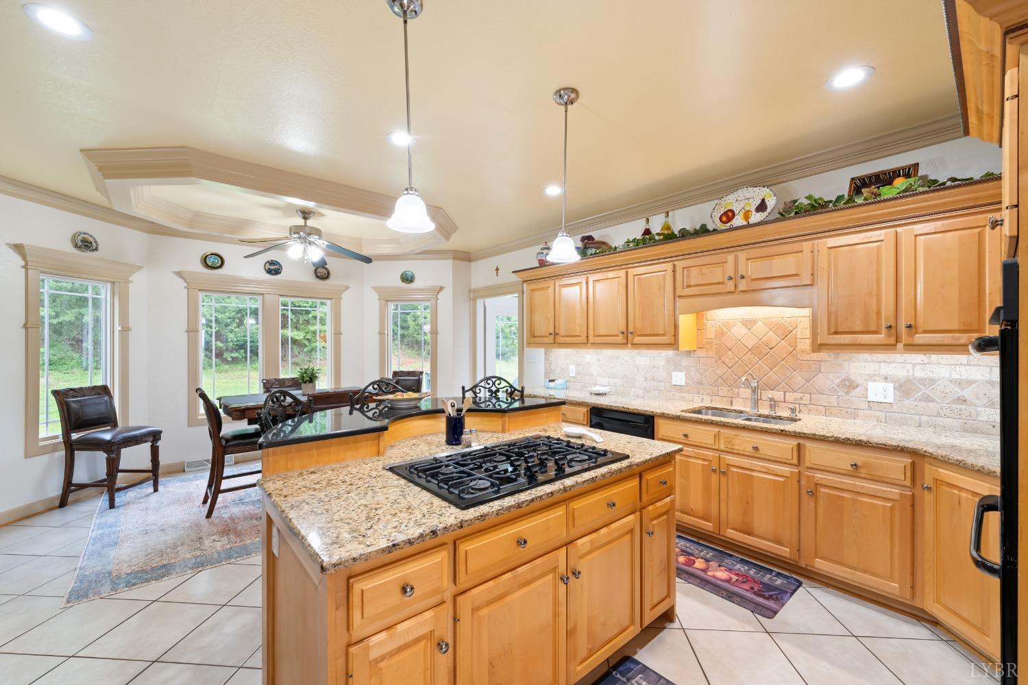 1136 Heavens View Drive Goode, VA 24556 - Photo 13 of 60 a kitchen with a stove a sink a dining table and chairs