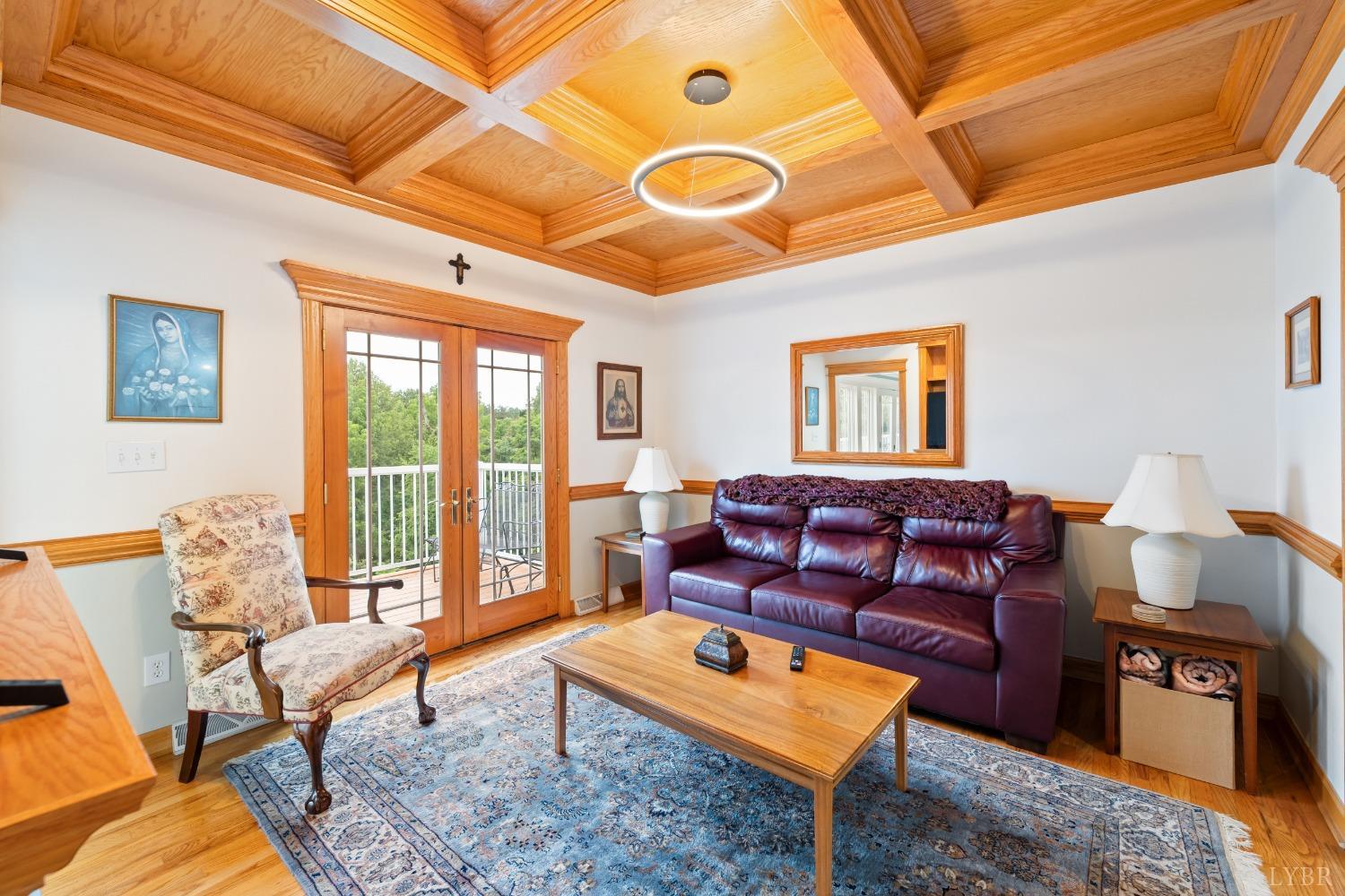 1136 Heavens View Drive Goode, VA 24556 - Photo 17 of 60 a living room with furniture a rug and a large window