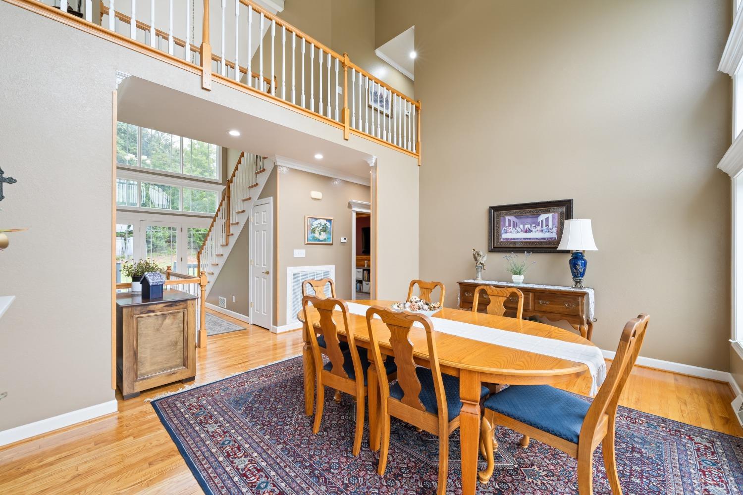 1136 Heavens View Drive Goode, VA 24556 - Photo 19 of 60 a dining room with furniture and wooden floor