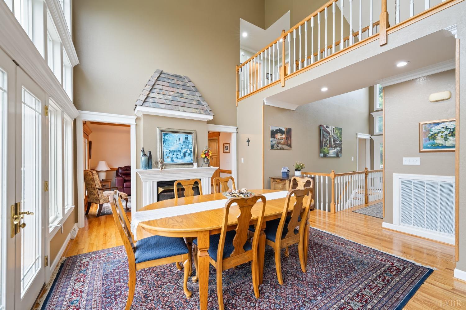 1136 Heavens View Drive Goode, VA 24556 - Photo 20 of 60 a view of a dining room with furniture and wooden floor