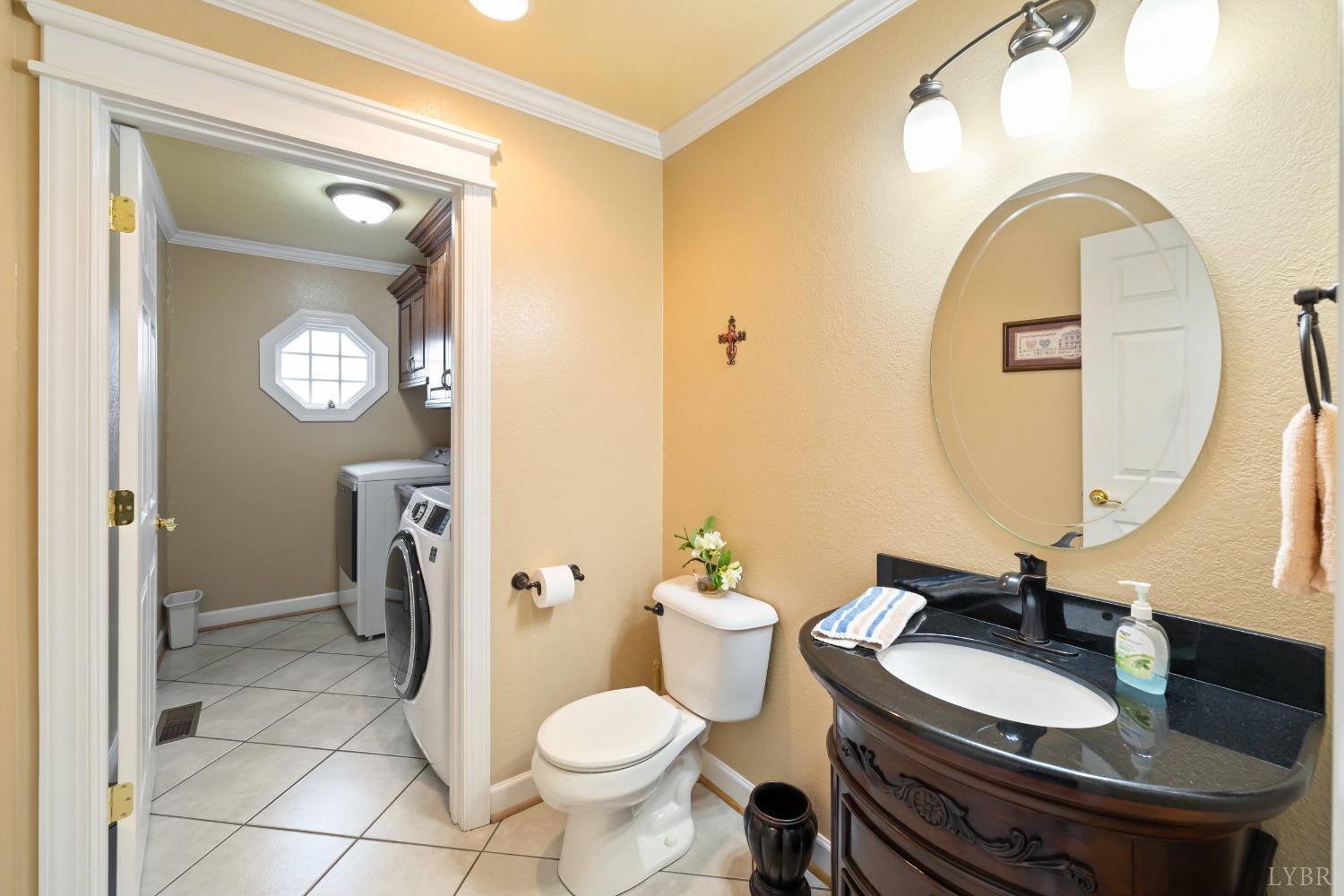 1136 Heavens View Drive Goode, VA 24556 - Photo 21 of 60 a bathroom with a sink a toilet and a mirror