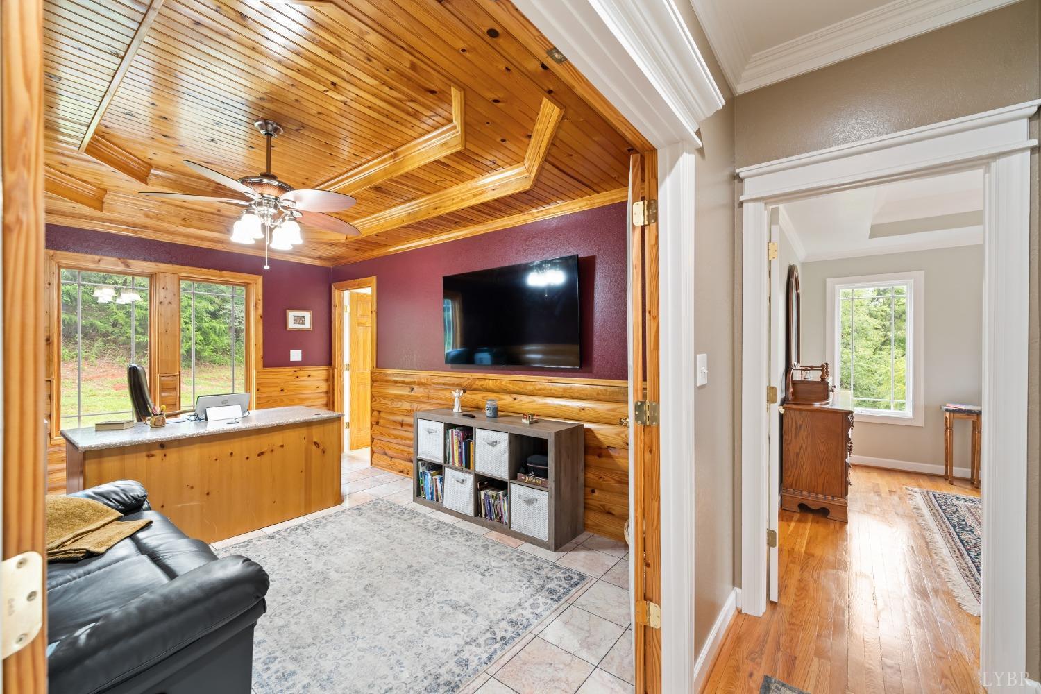 1136 Heavens View Drive Goode, VA 24556 - Photo 23 of 60 a living room with furniture and a flat screen tv