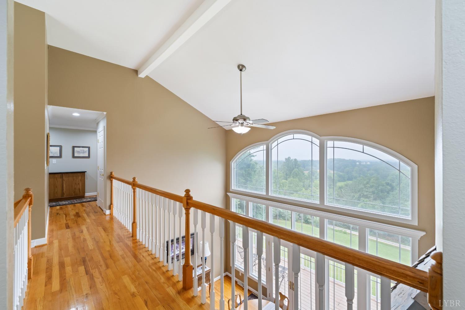1136 Heavens View Drive Goode, VA 24556 - Photo 37 of 60 a view of a hallway with wooden floor and stairs
