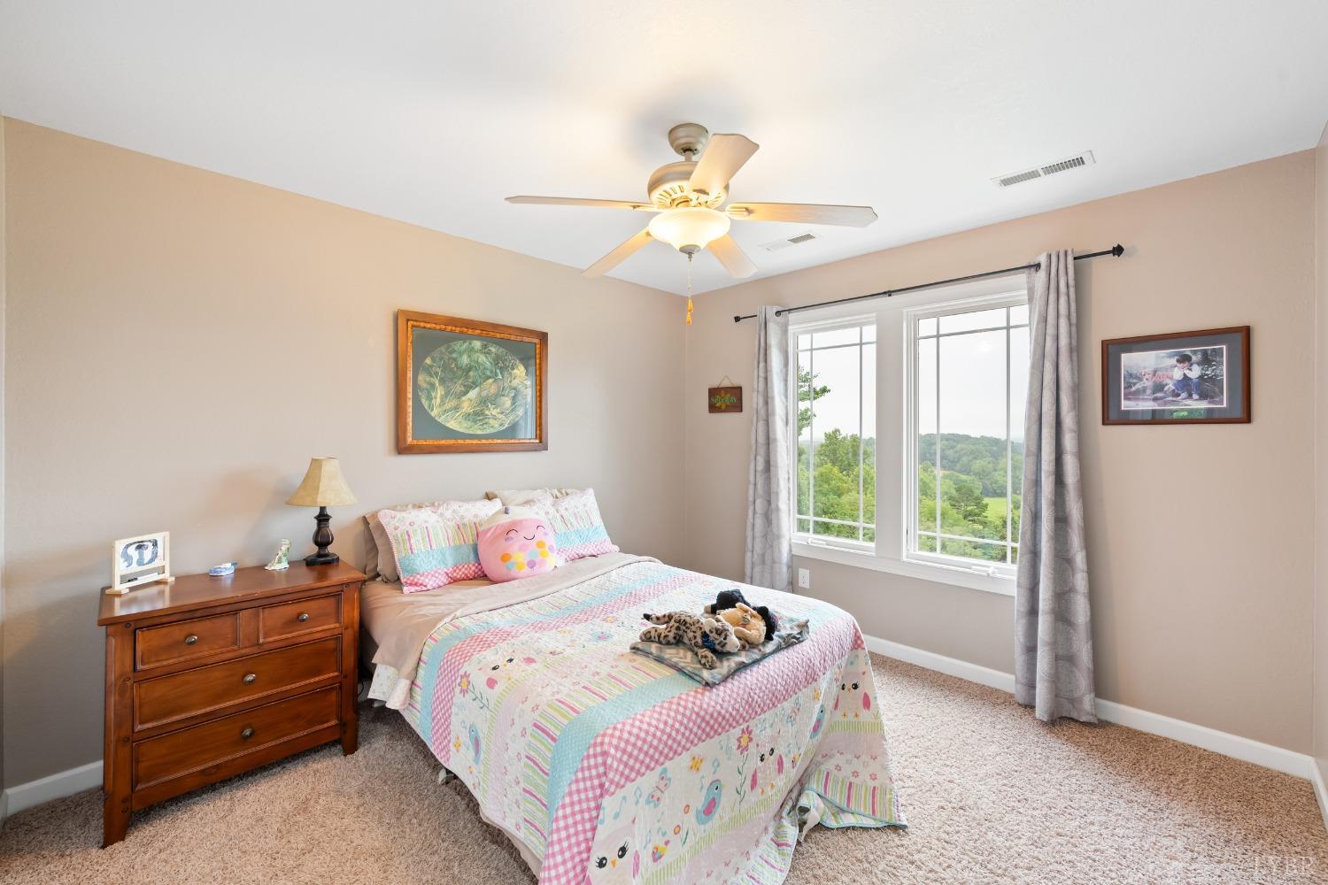 1136 Heavens View Drive Goode, VA 24556 - Photo 44 of 60 a bedroom with a bed and a window