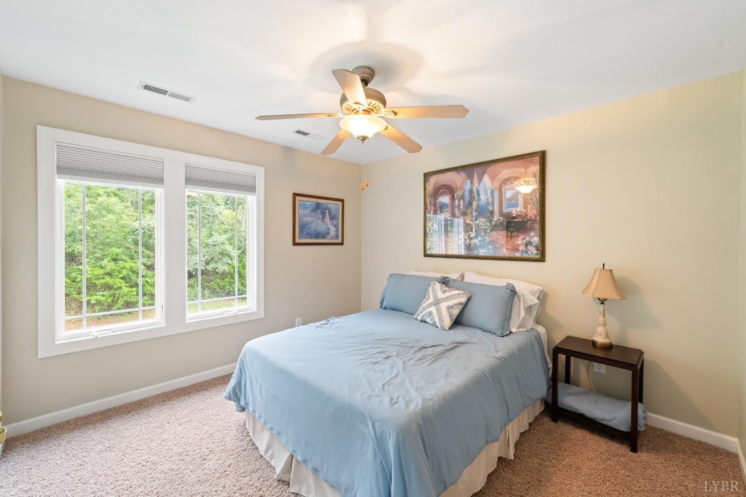 1136 Heavens View Drive Goode, VA 24556 - Photo 46 of 60 a bedroom with a large bed and a window