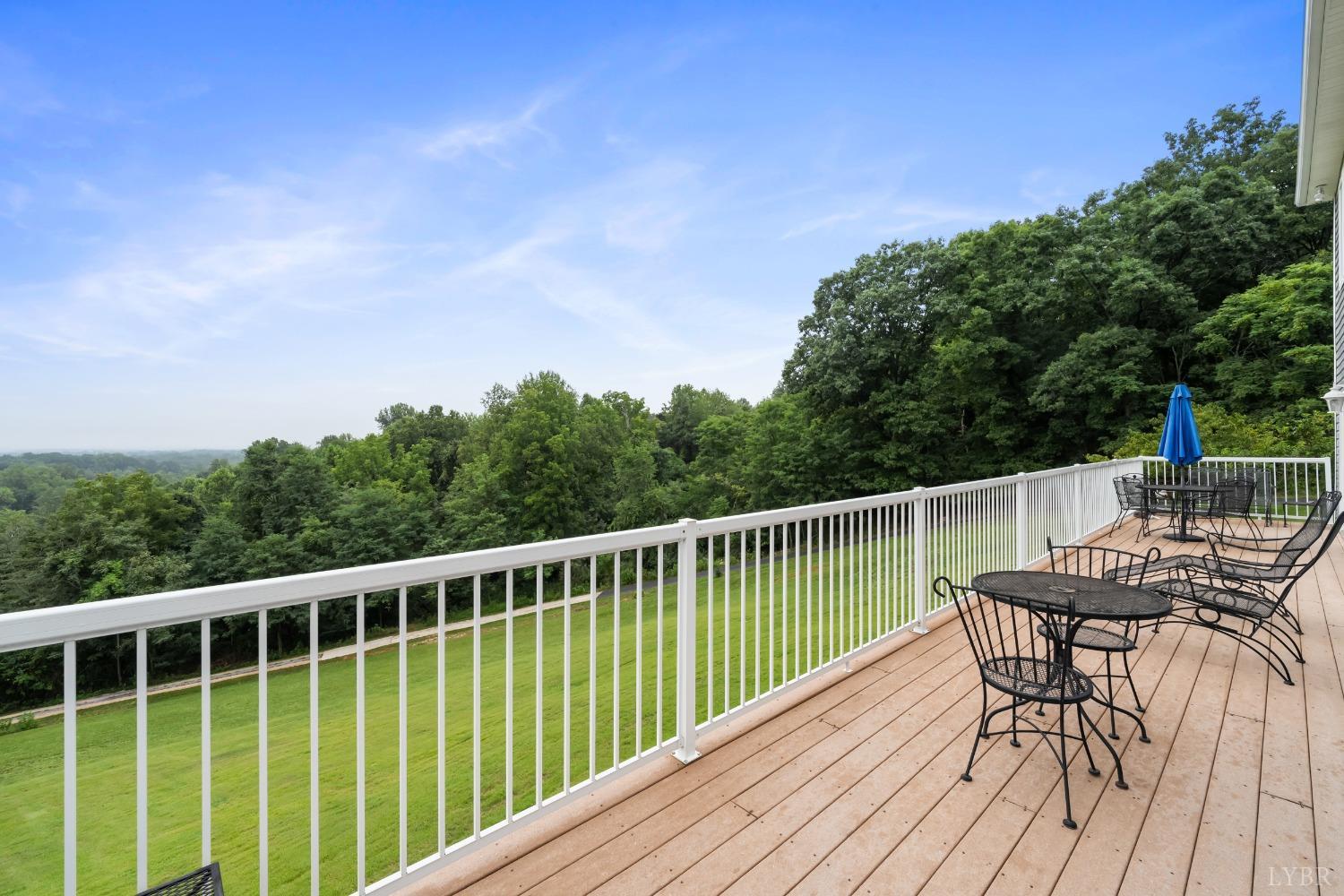 1136 Heavens View Drive Goode, VA 24556 - Photo 6 of 60 a view of a balcony with chairs