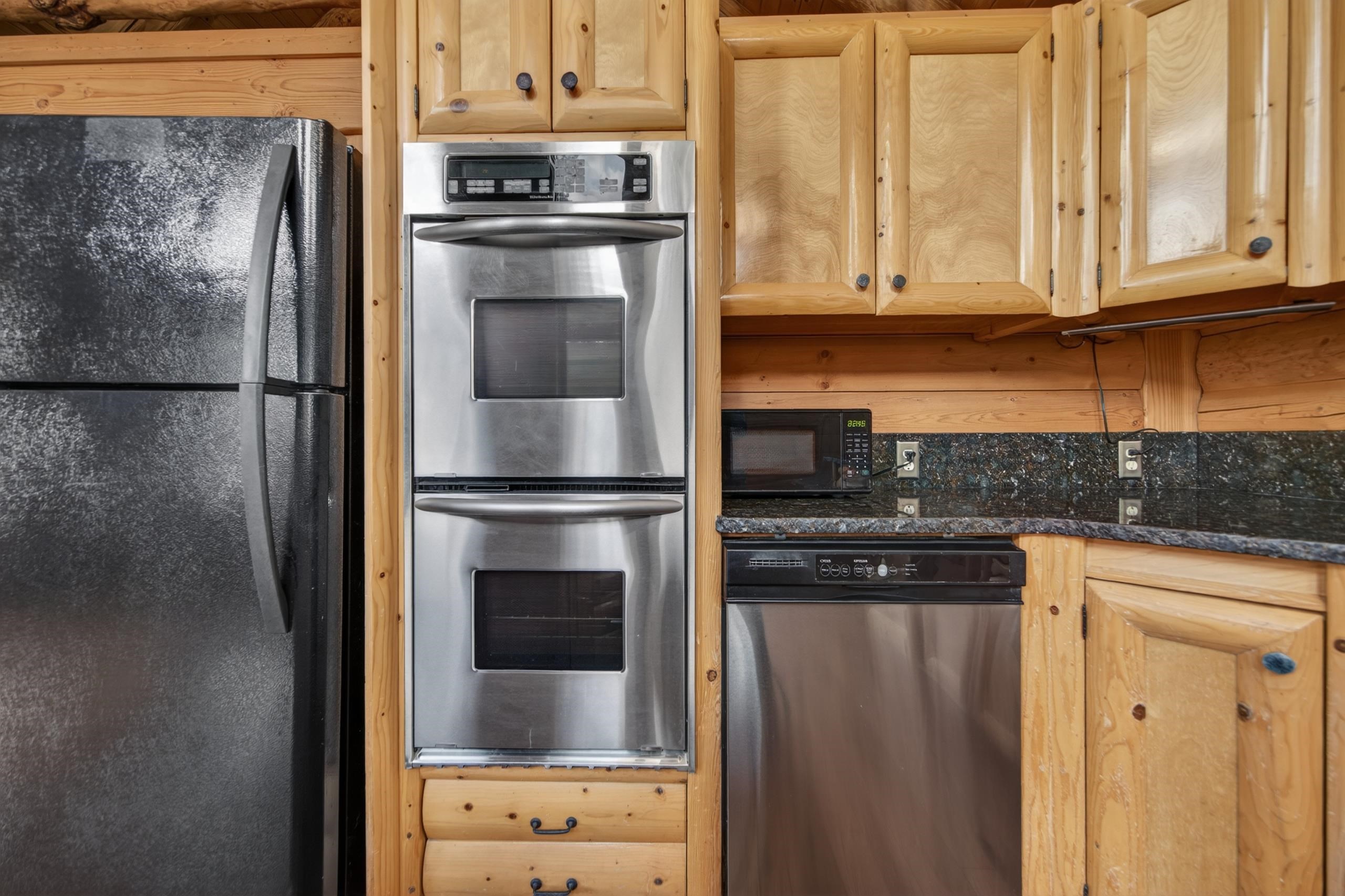 645 Main Street Chester, CA 96020 - Photo 32 of 43 a kitchen with stainless steel appliances granite countertop a refrigerator and a stove