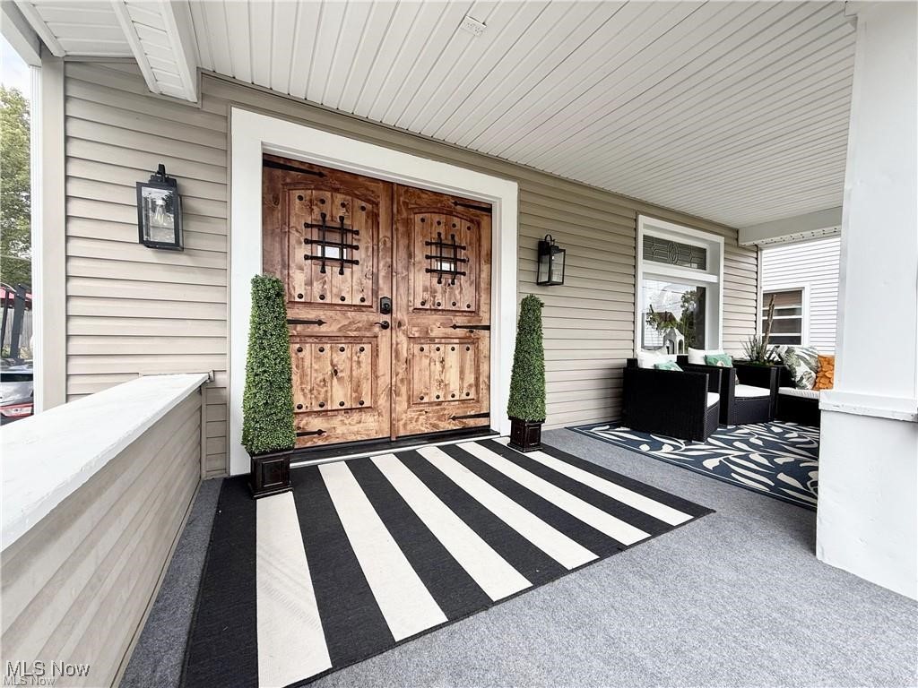 281 Sexton Street Struthers, OH 44471 - Photo 2 of 28 Doorway to property featuring a porch