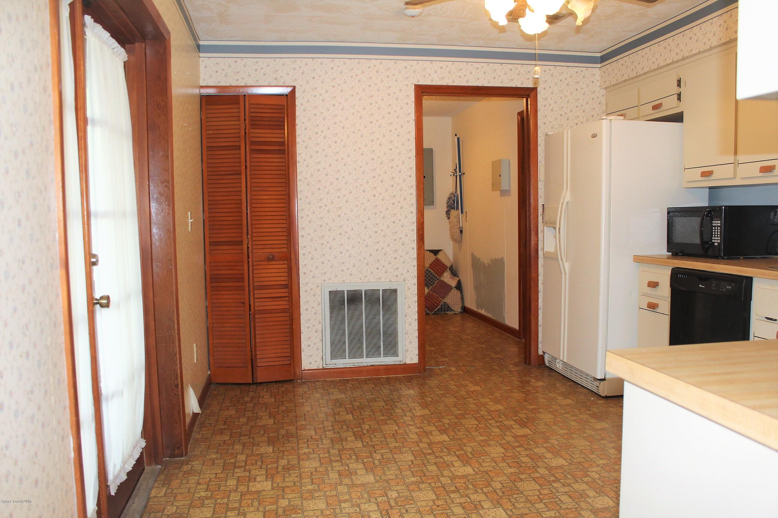 6845 Cairo Road Cocoa, FL 32927 - Photo 27 of 29 Kitchen to Laundry & Gar