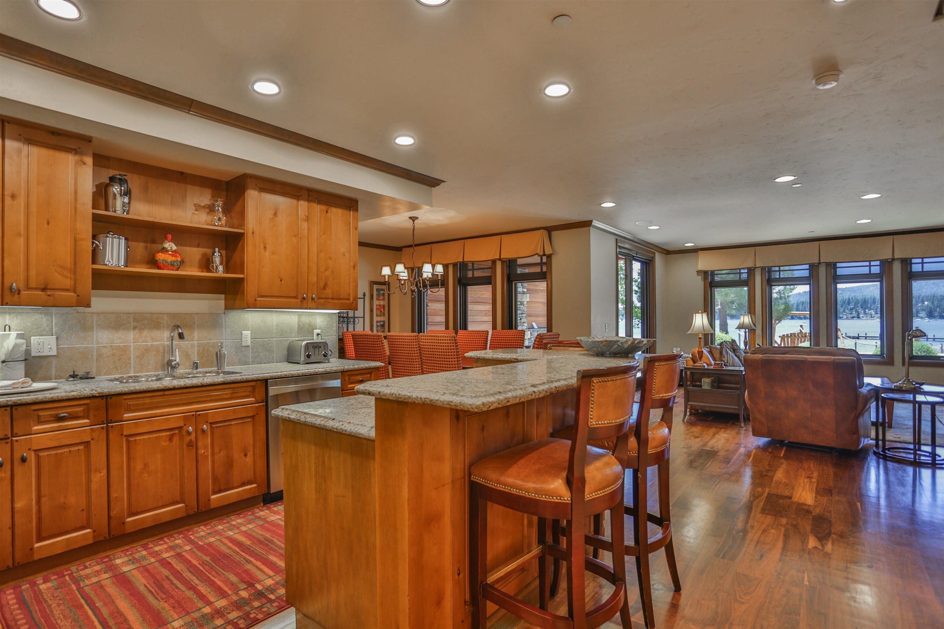 6750 North Lake Boulevard, Unit 3C Tahoe Vista, CA 96148 - Photo 11 of 22 a kitchen with lots of counter top space and painting on the wall