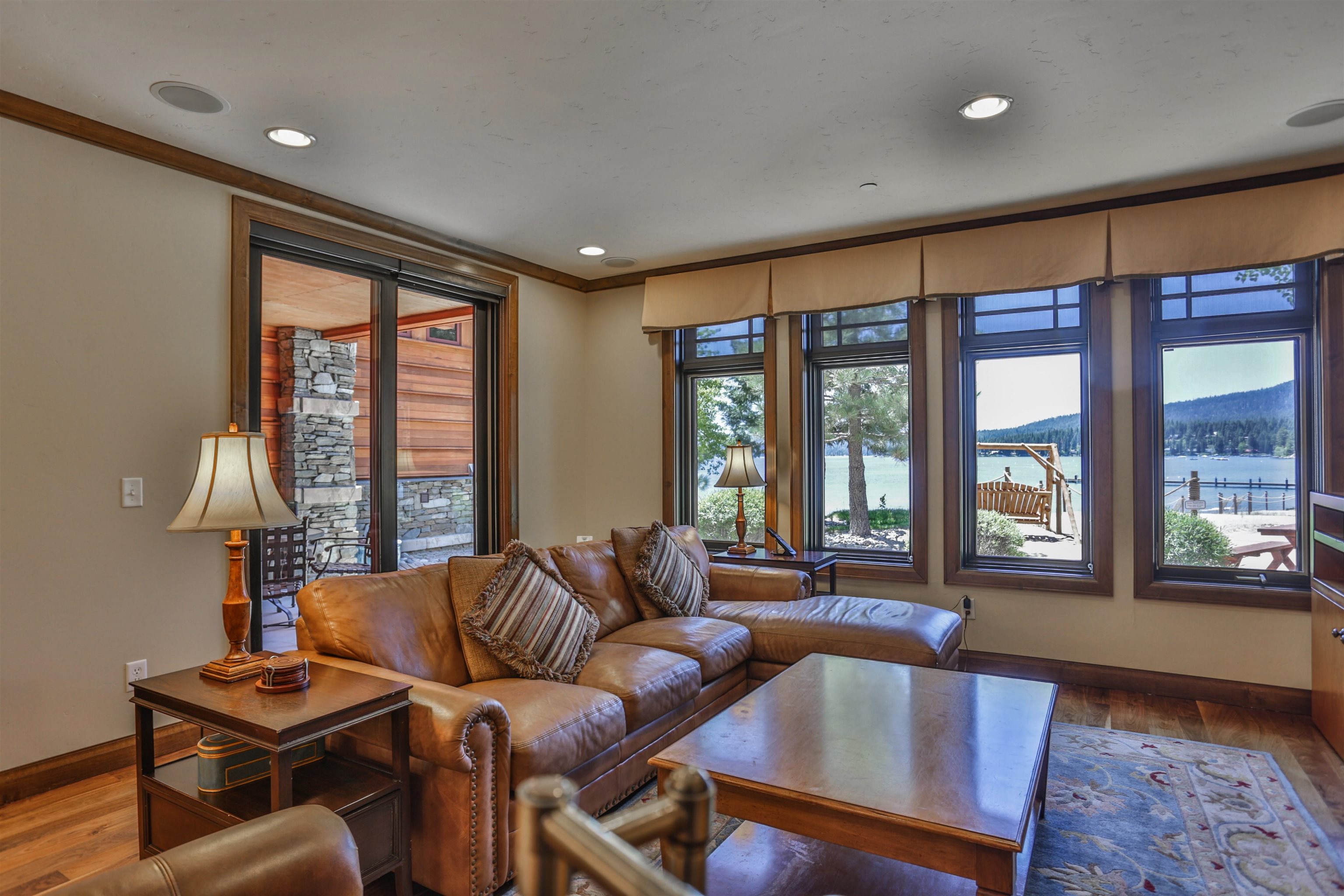 6750 North Lake Boulevard, Unit 3C Tahoe Vista, CA 96148 - Photo 16 of 22 a living room with furniture and floor to ceiling windows