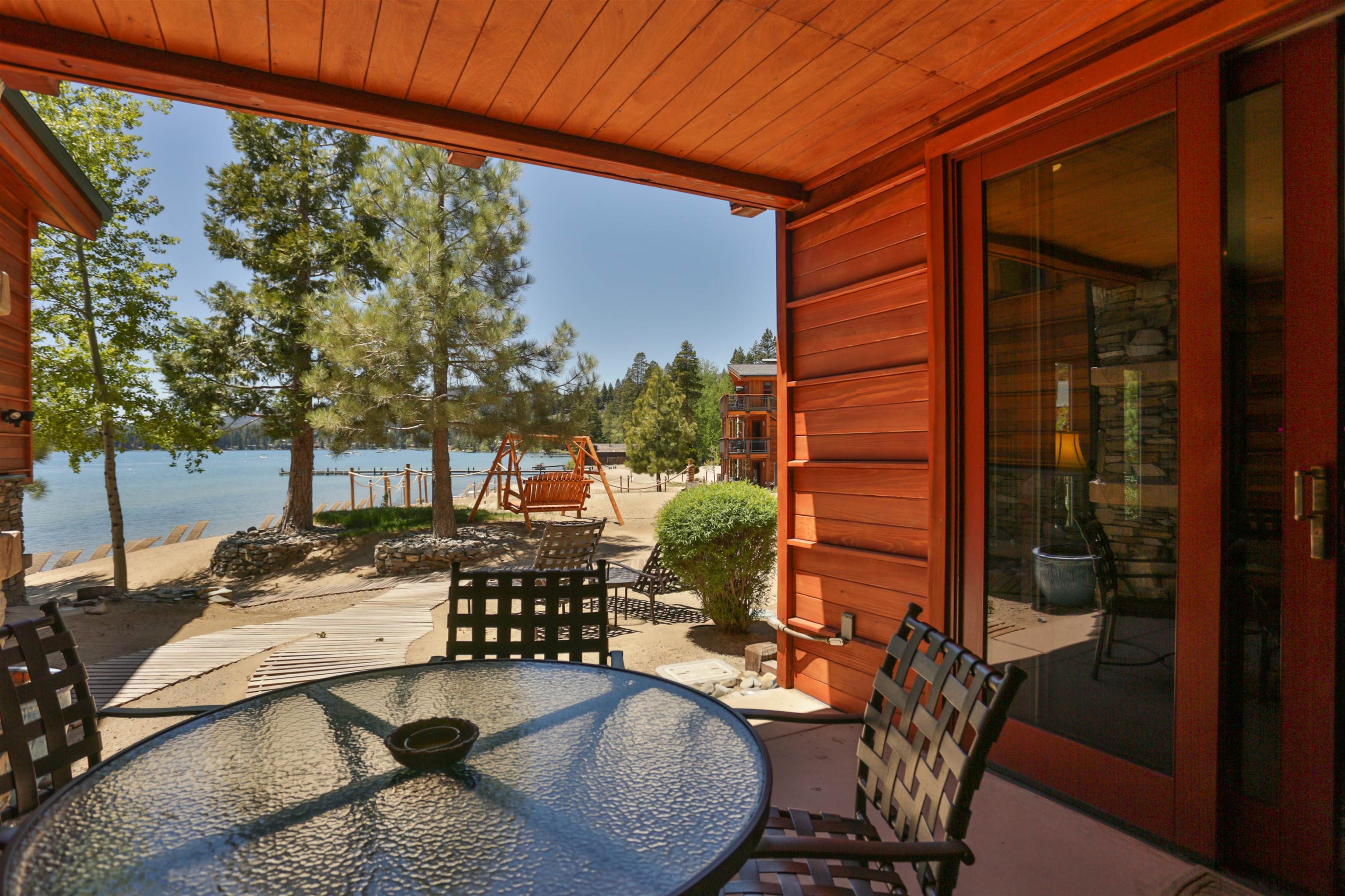 6750 North Lake Boulevard, Unit 3C Tahoe Vista, CA 96148 - Photo 18 of 22 a view of a patio with table and chairs and potted plants