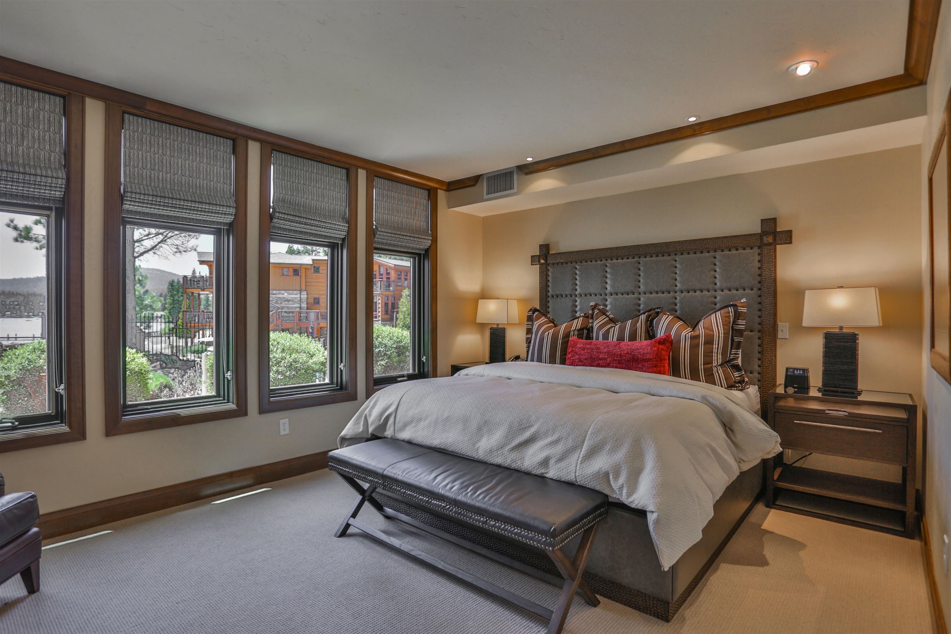 6750 North Lake Boulevard, Unit 3C Tahoe Vista, CA 96148 - Photo 4 of 22 a bed sitting in a bedroom next to a window