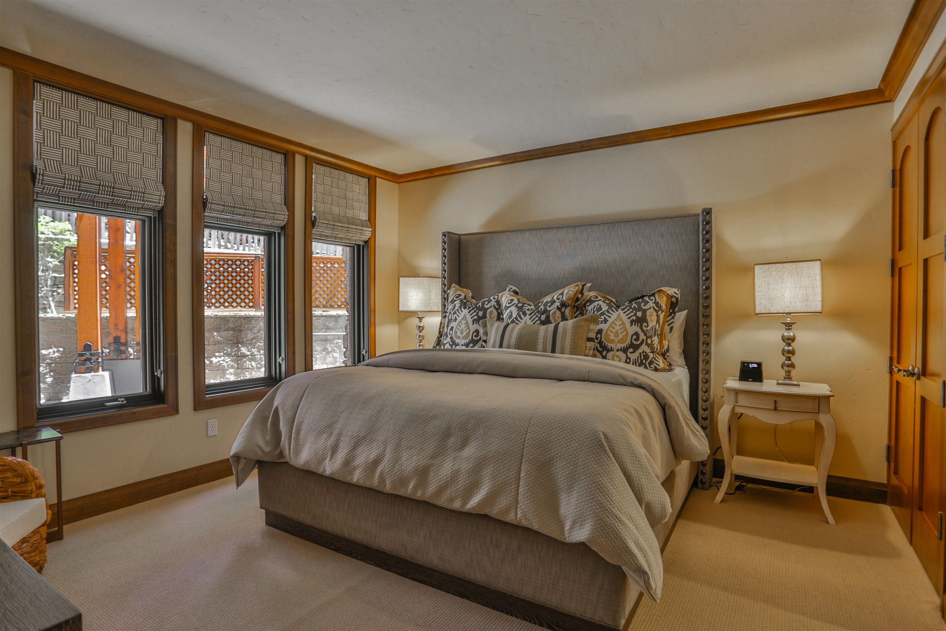 6750 North Lake Boulevard, Unit 3C Tahoe Vista, CA 96148 - Photo 6 of 22 a bed sitting in a bedroom next to a window