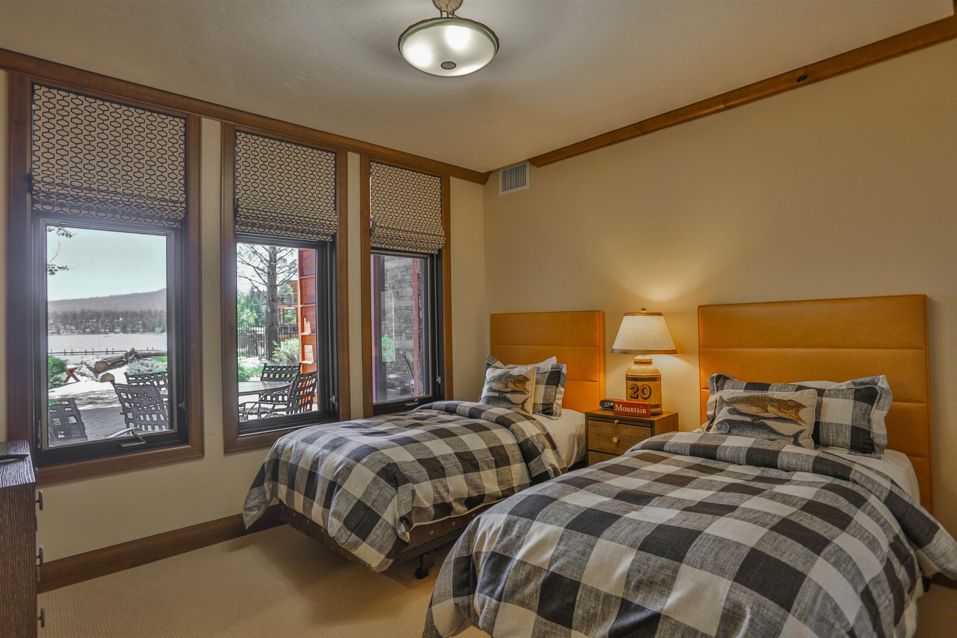 6750 North Lake Boulevard, Unit 3C Tahoe Vista, CA 96148 - Photo 7 of 22 a bedroom with two beds and large window