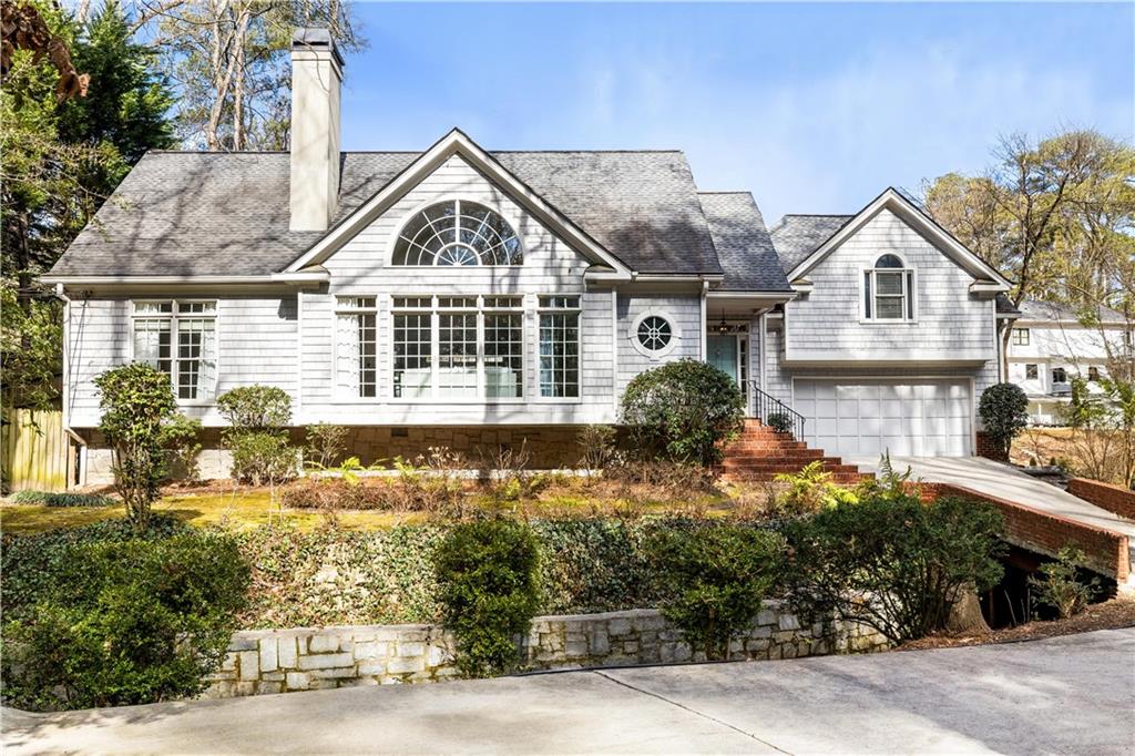 1134 Ferncliff Road Northeast Atlanta, GA 30324 - Photo 1 of 1 a front view of a house with a yard