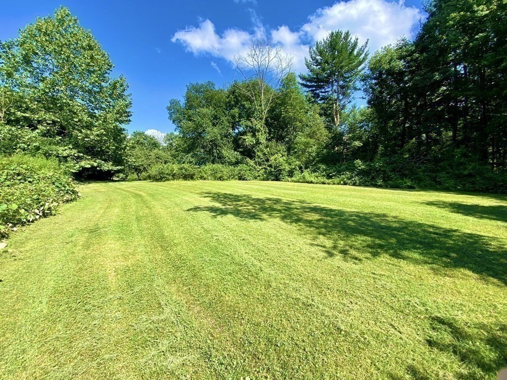 152 Pierce Road West Brookfield, MA 01585 - Photo 13 of 41 a view of a big yard with swimming pool and green space
