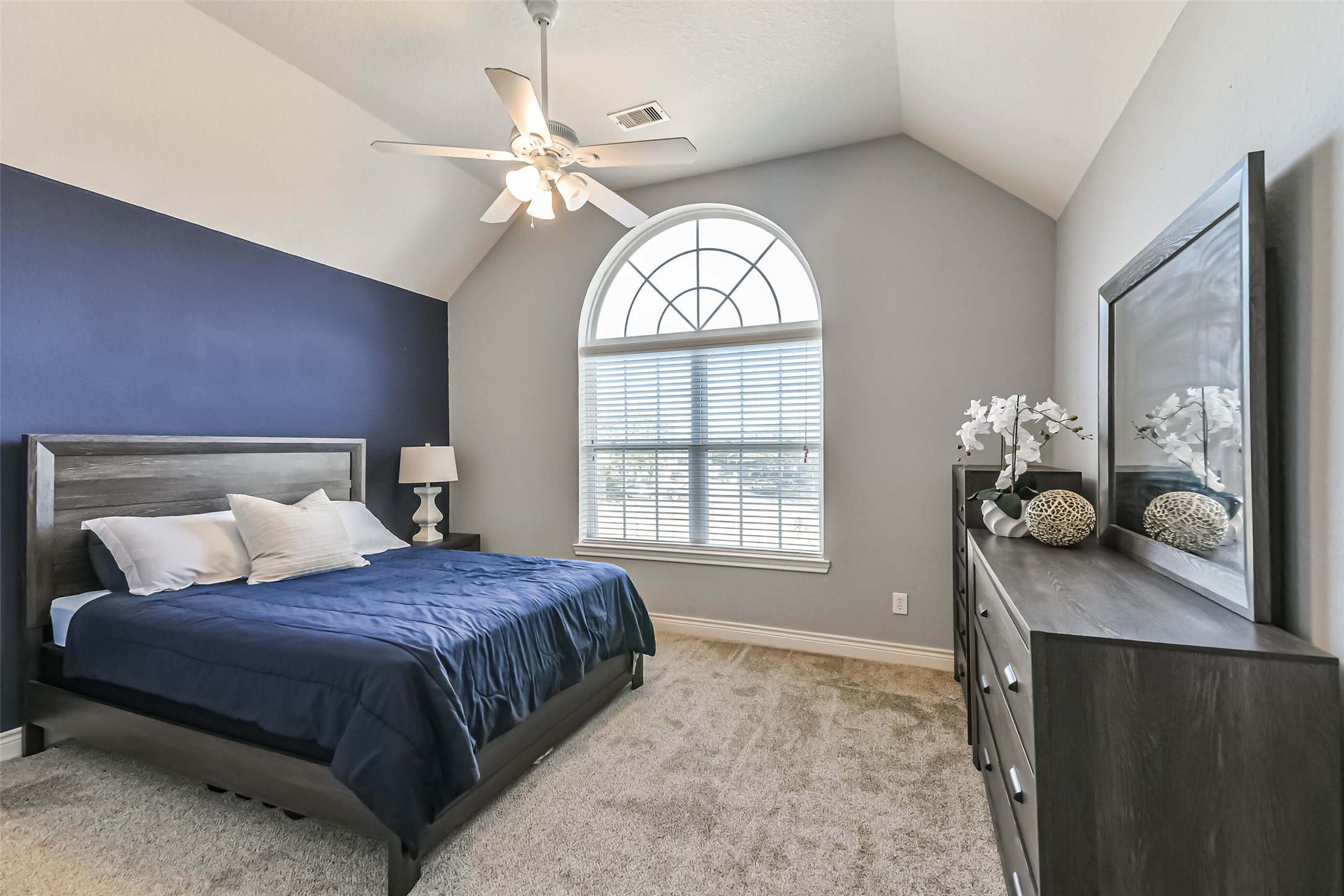 19022 Greenleaf Ridge Court Cypress, TX 77429 - Photo 34 of 47 a bedroom with a bed mirror and window