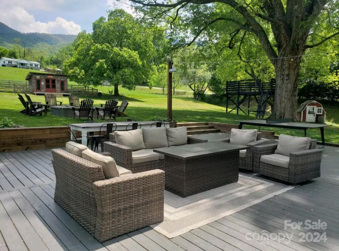4625 Dutch Cove Road Canton, NC 28716 - Photo 4 of 48 a view of patio with couches and a fire pit