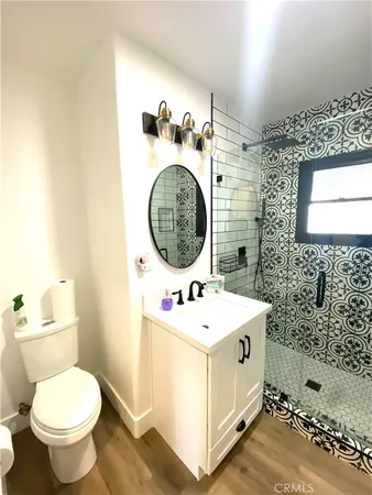 a kitchen with stainless steel appliances granite countertop a stove and a sink