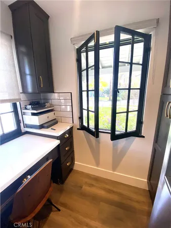 a stove top oven sitting inside of a kitchen