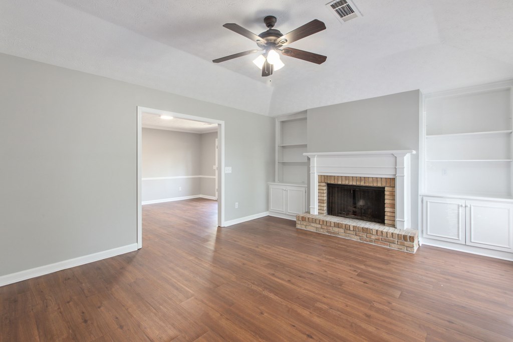 3613 Maryland Circle, Unit A Columbus, GA 31907 - Photo 20 of 28 a view of an empty room with a fireplace and a window