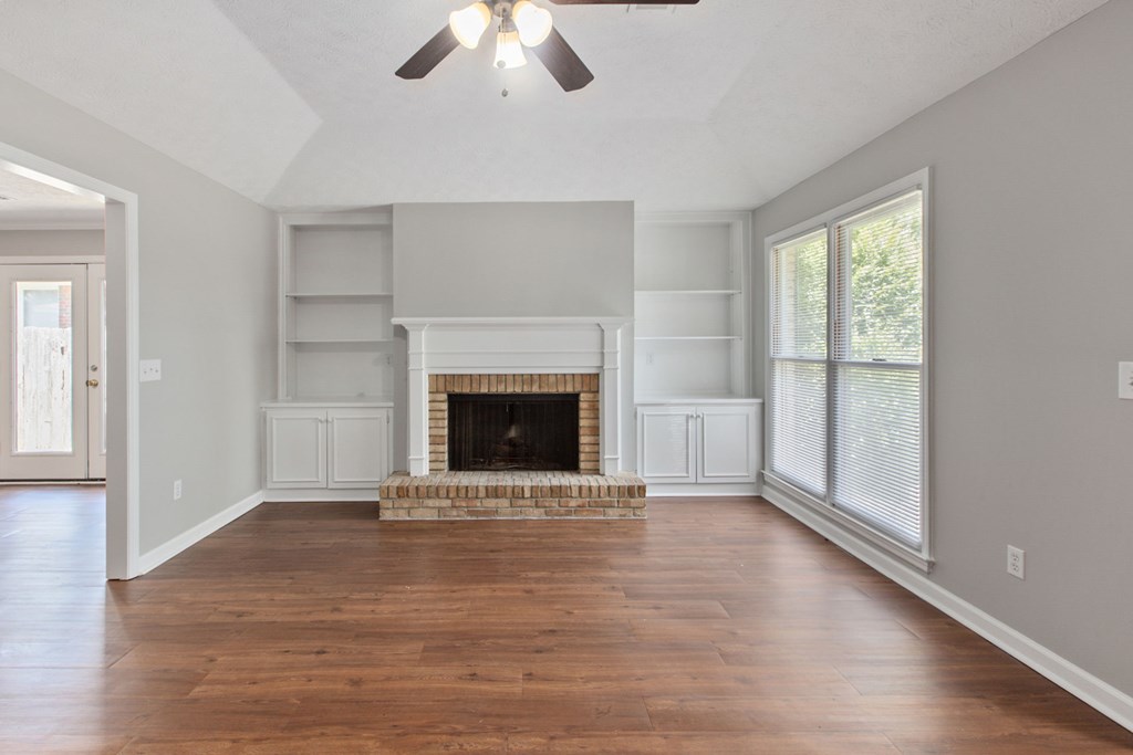 3613 Maryland Circle, Unit A Columbus, GA 31907 - Photo 23 of 28 an empty room with windows and a fireplace