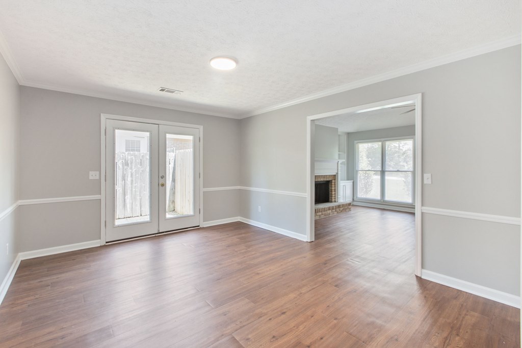3613 Maryland Circle, Unit A Columbus, GA 31907 - Photo 24 of 28 an empty room with wooden floor and windows