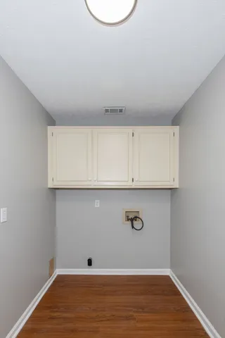 a view of room with wooden floor