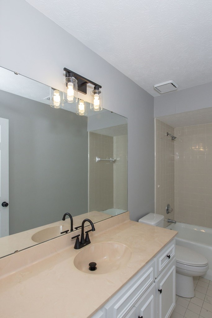 3613 Maryland Circle, Unit A Columbus, GA 31907 - Photo 7 of 28 a bathroom with a sink and a mirror